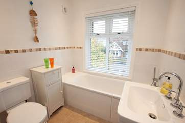There is a bright family bathroom on the first floor.