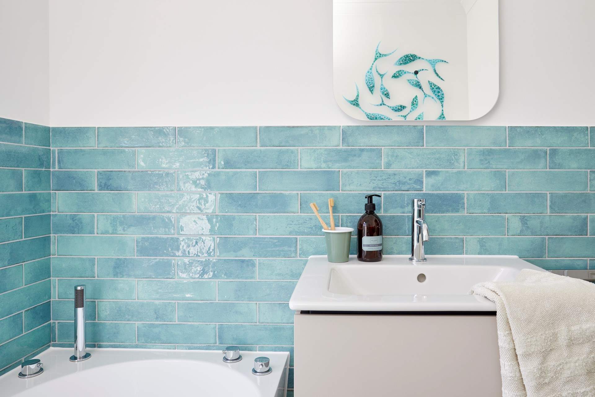 Fresh coastal style in the family bathroom. 