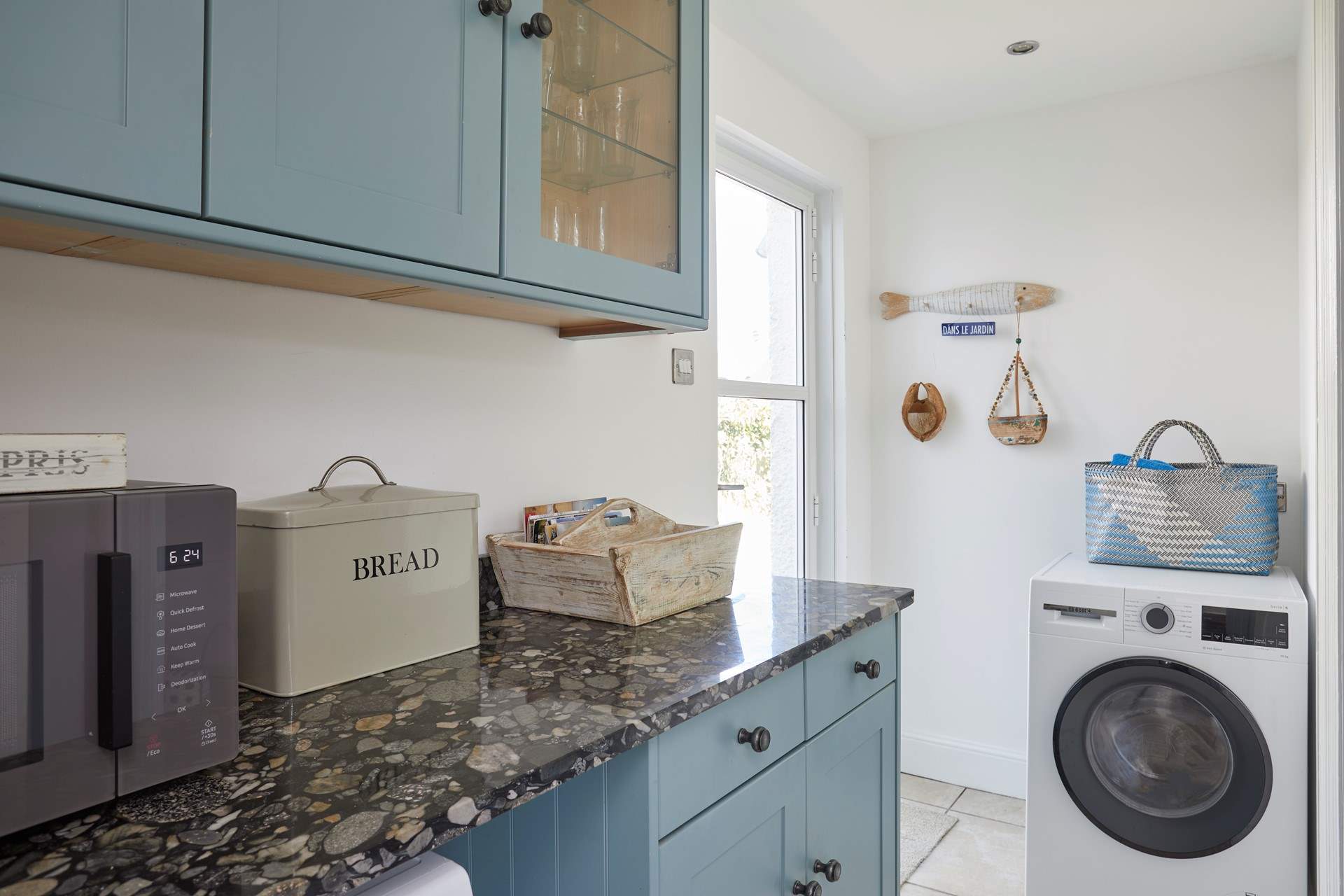 There is a handy utility area for all your washing needs.