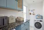 There is a handy utility area for all your washing needs.
