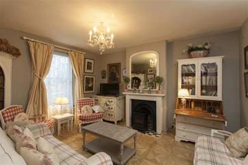 The living room features period touches along with modern comfort.
