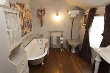 In the bathroom, Victorian decor meets modern luxury.
