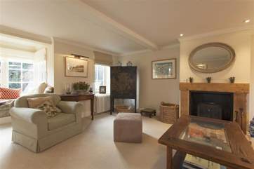 The sitting-room has high quality furniture and fittings.