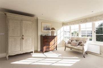 The spacious master bedroom has sea views.