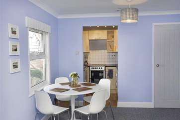 The dining-area is very close to the kitchen.