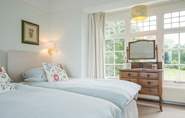 The twin bedroom with views over the well-tended garden.