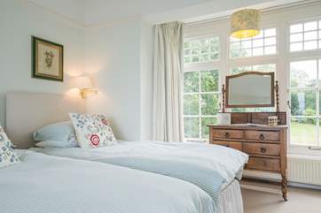The twin bedroom with views over the well-tended garden.