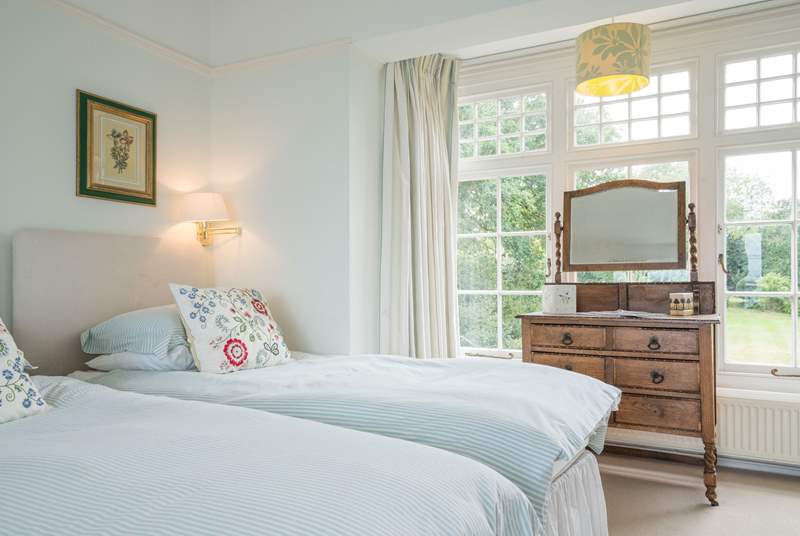 The twin bedroom with views over the well-tended garden.