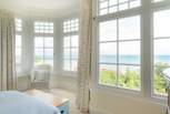 The bay windows of the single bedroom offer a fabulous vista at any time of day.
