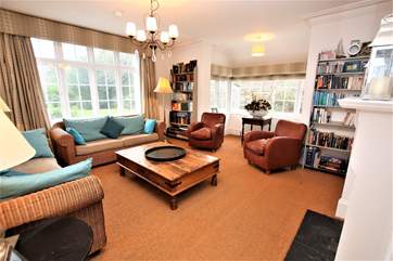The light and airy sitting-room overlooks the garden