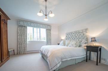 The master bedroom with a large en suite bathroom.