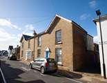 Yardley is the  pretty cottage with the sky-blue door in the heart of Seaview.