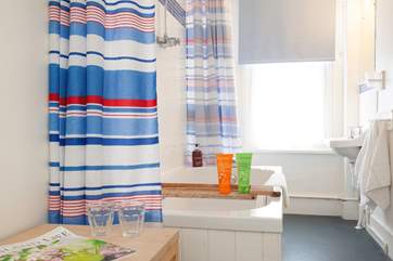 The family bathroom features a modern shower over the bath.