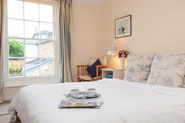 The double bedroom boasts simple but delightful decor.