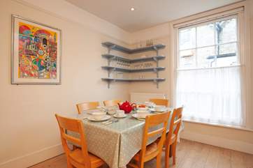 The bright, charming dining-area in the kitchen makes meals a pleasure.