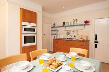 The kitchen/dining-room is spacious and well-equipped.