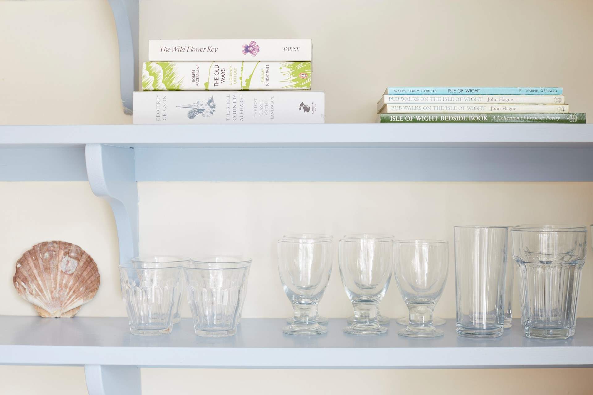 Detail of glassware and books in the kitchen.