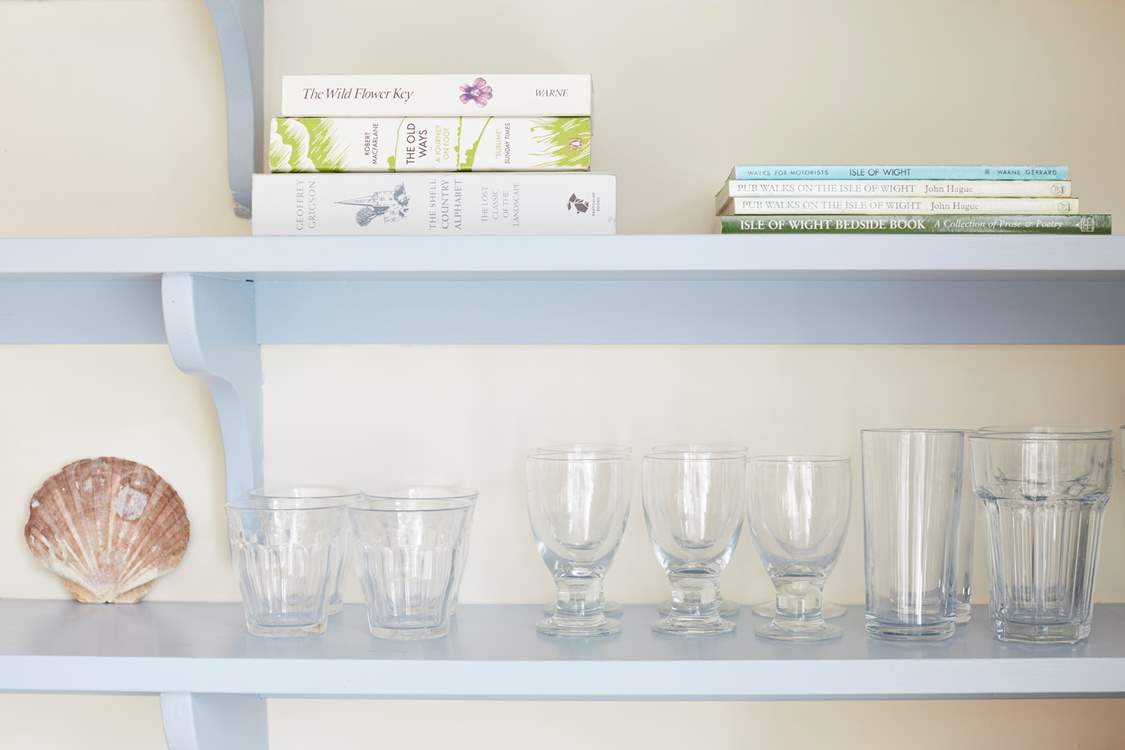 Detail of glassware and books in the kitchen.