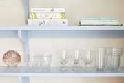 Detail of glassware and books in the kitchen.