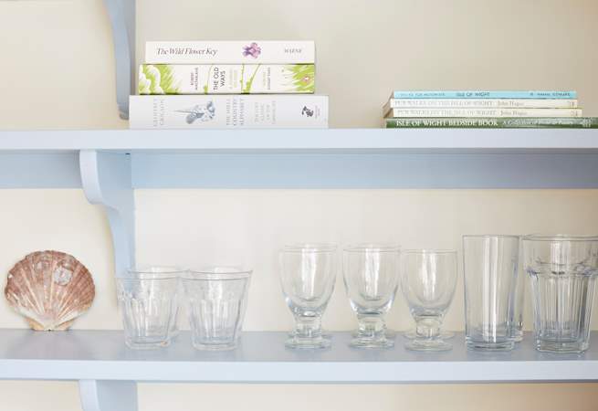 Detail of glassware and books in the kitchen.