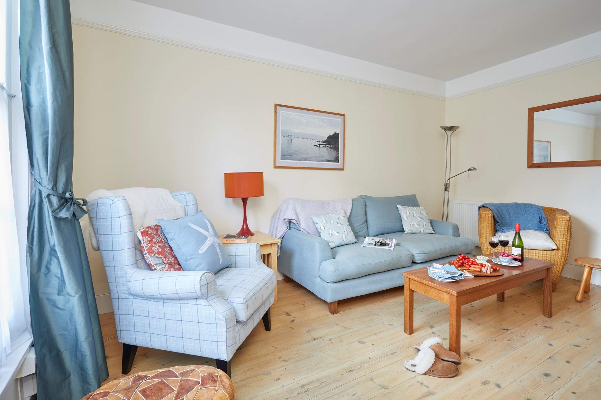 The comfortable sitting-room is a well proportioned size.