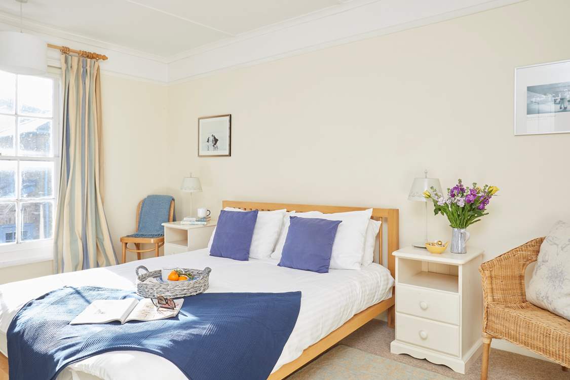 The king-size double bed in the main bedroom.
