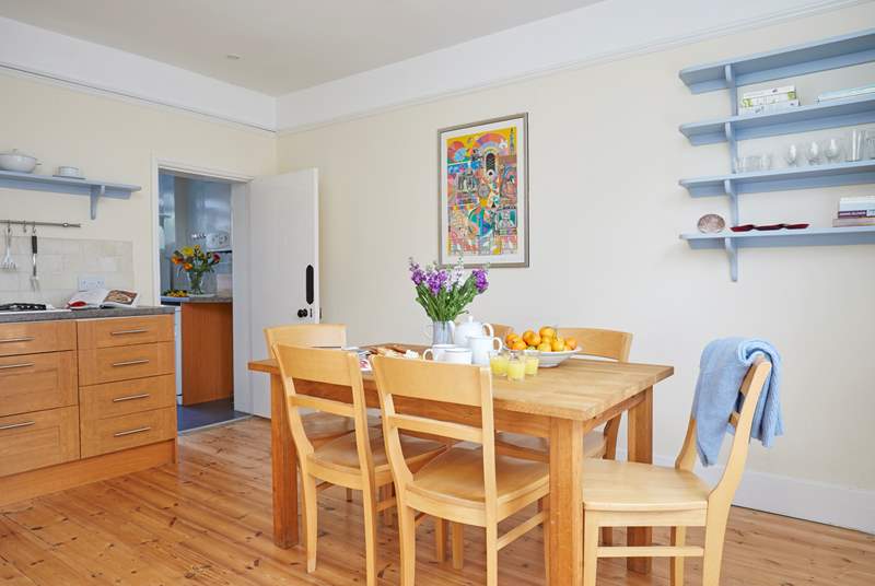 The welcoming dining table in the kitchen for all your scrumptious family meals.