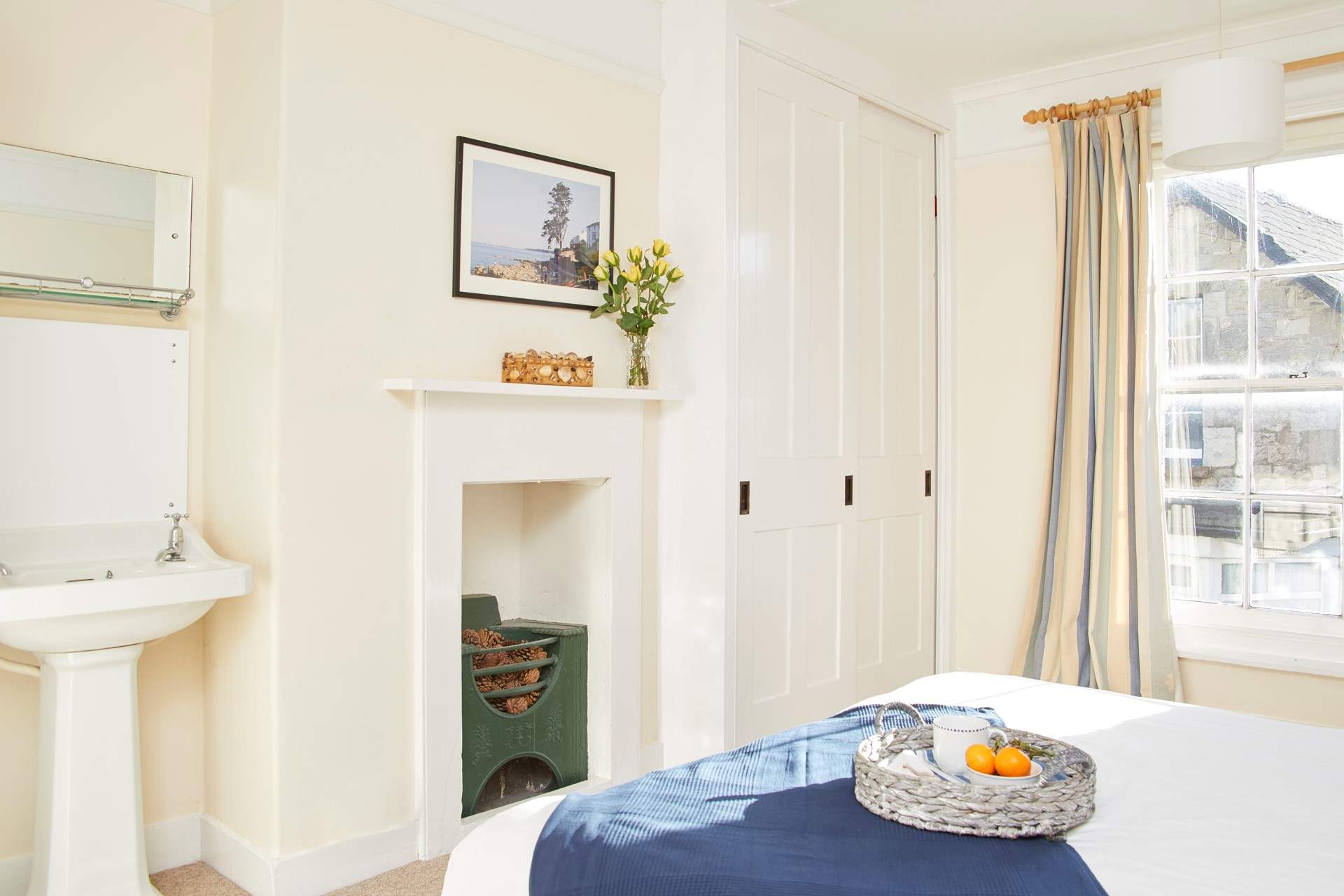 The main bedroom is light and airy with built in wardrobe for your  holiday clothes.