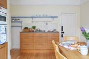 The kitchen is well equipped with the essentials for making a lovely meal at home.