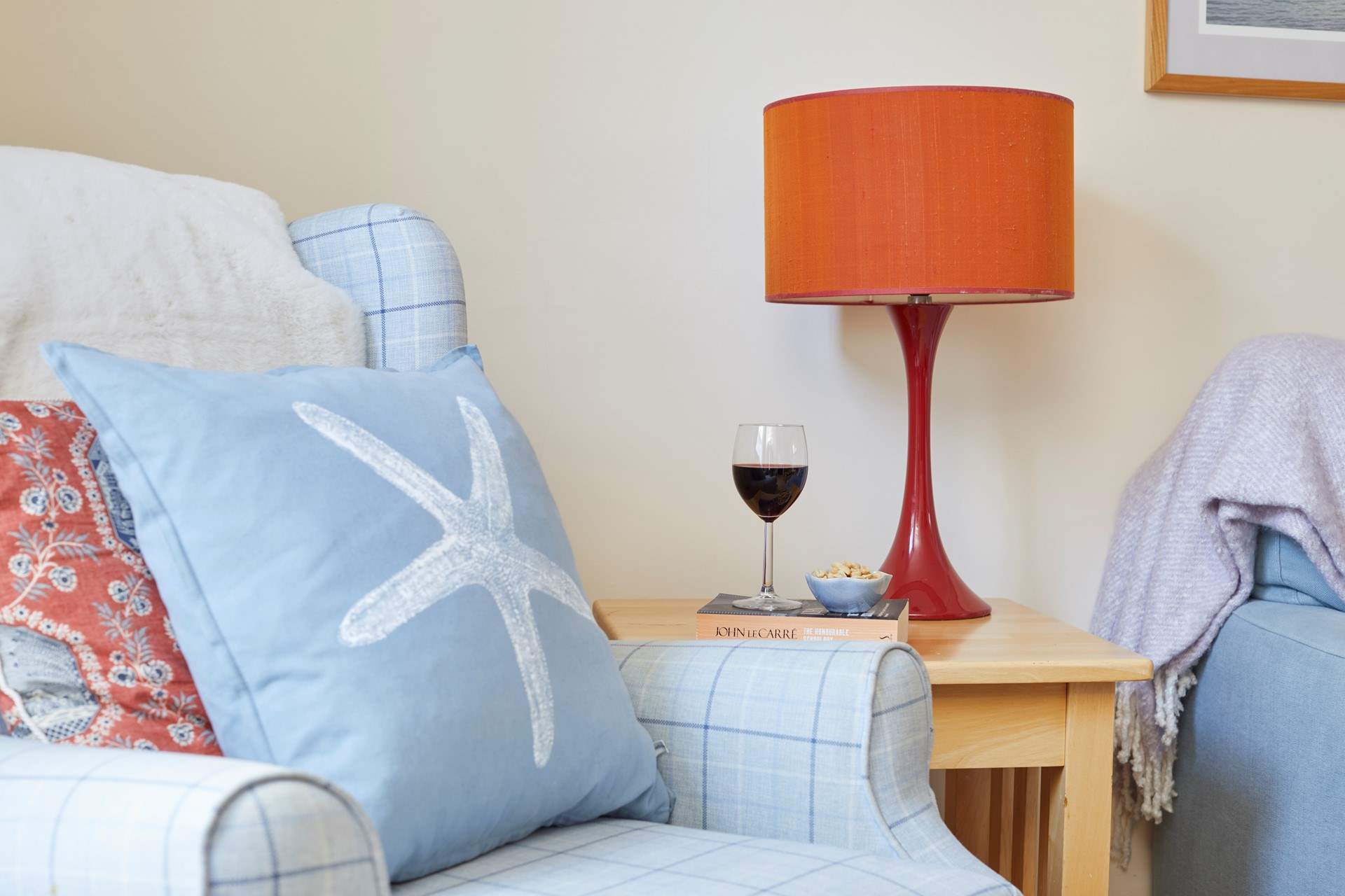 A cosy armchair and a good book with a lovely glass of wine.  What more could you ask for.
