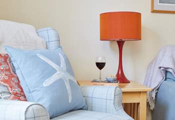 A cosy armchair and a good book with a lovely glass of wine.  What more could you ask for.