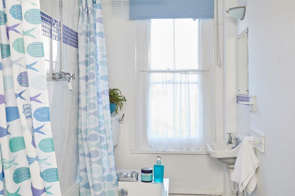 The family bathroom with bath and over head shower.