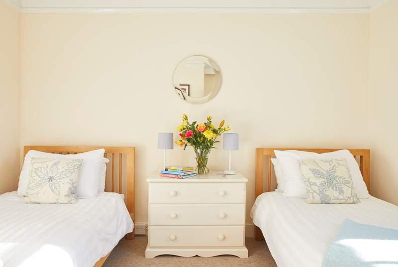The second bedroom boasts twin beds. Perfect for both children and adults.