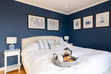 The main bedroom leads down to the garden via the balcony.