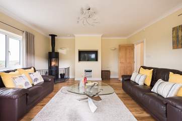 Relax in front of the TV, play games or read a book in the comfy sitting-room.