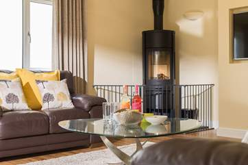 The modern wood-burner gives off a lovely glow and keeps you cosy on those cooler days and nights.
