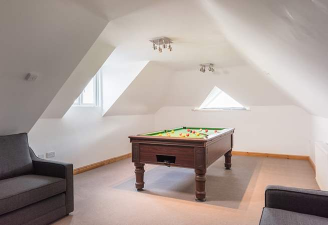 The games-room is kitted out with a pool table, bean bags and a chalk board for keeping score.