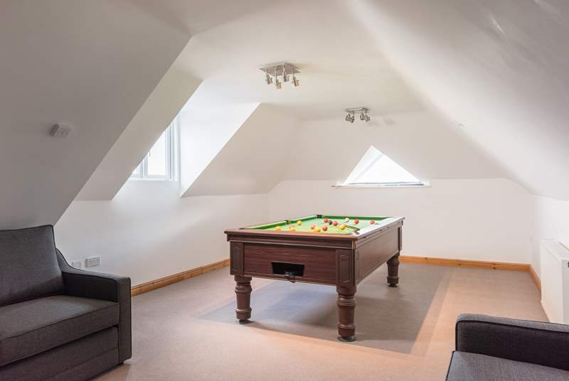 The games-room is kitted out with a pool table and a flat screen TV.
