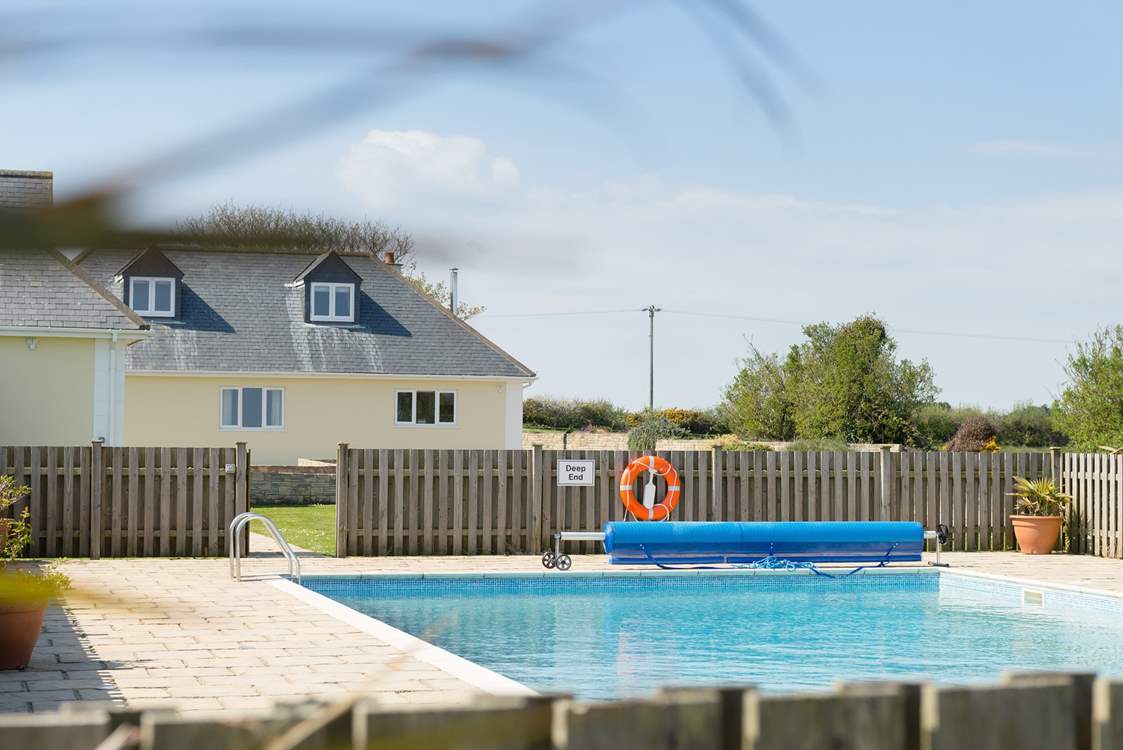 Looking back to the house from the pool area during the day.