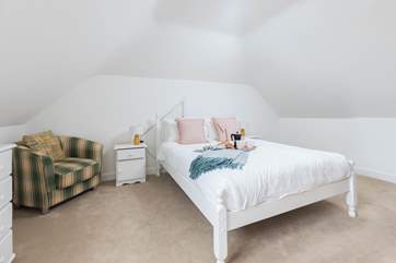 Calming tones in bedroom four and make you check the views from the window out to sea.