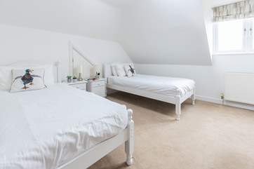 Twin beds in bedroom three also have the most amazing view out to sea.