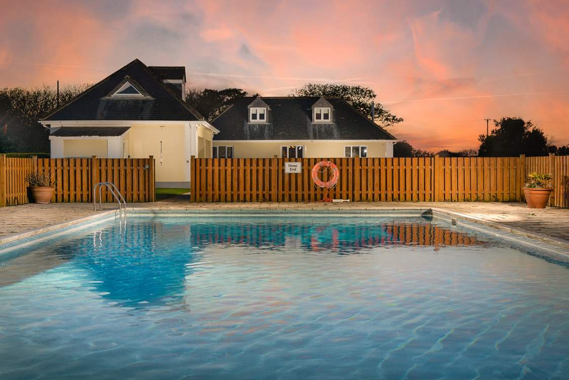 Looking back to the house from your private pool at dusk.