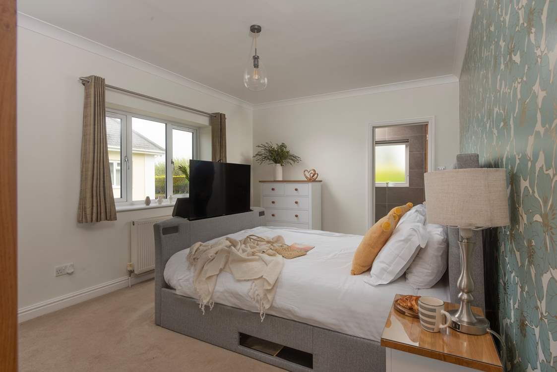 A comfy bed which houses a Smart TV.