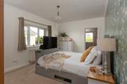 A comfy bed which houses a Smart TV.