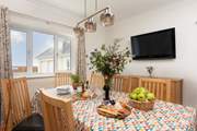 The dining-room is adjacent to the kitchen.