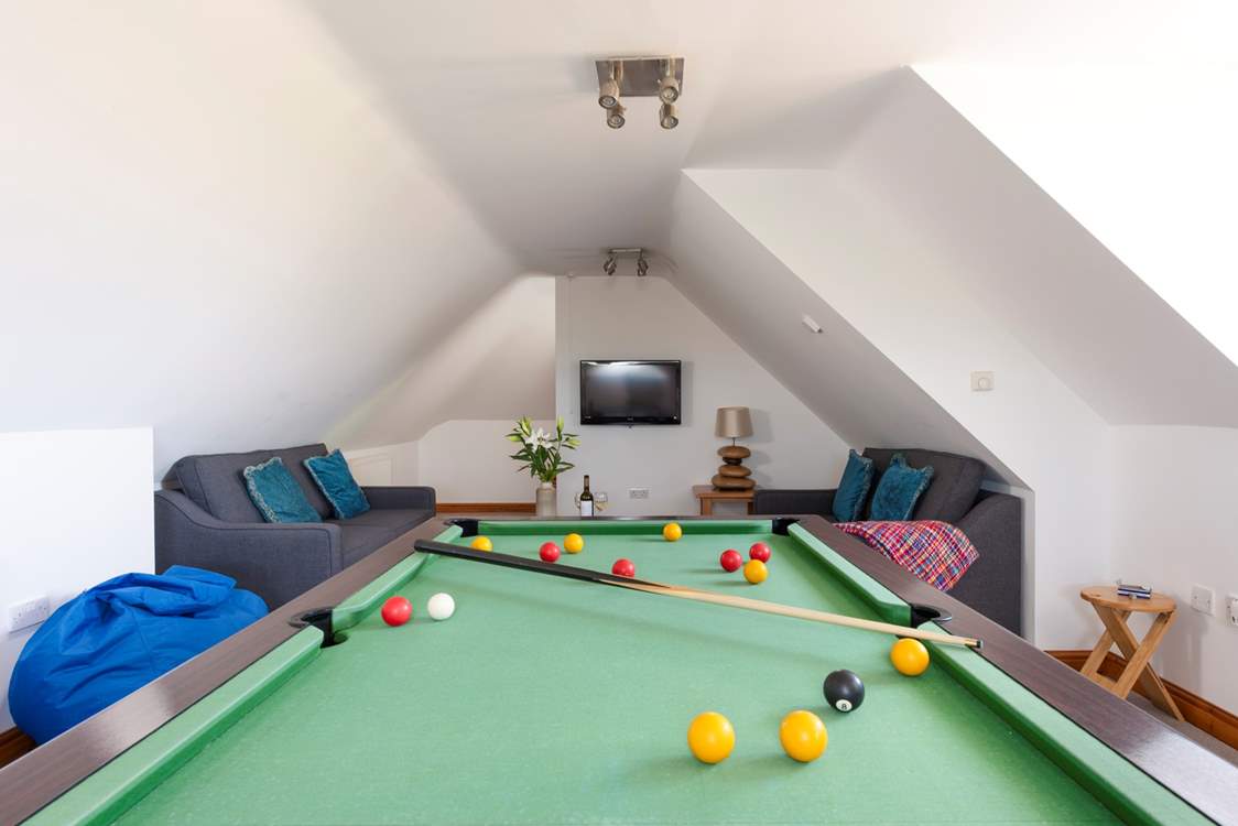 The games-room is kitted out with a pool table, bean bags and a chalk board for keeping score.