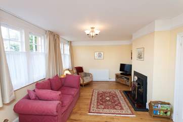 The living room is a comfortable haven with a nice fireplace