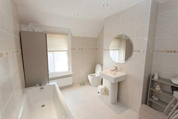 The family bathroom is both spacious and modern