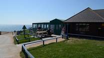 The Hive Beach Cafe at nearby Burton Bradstock serves locally caught seafood and delicious cakes.