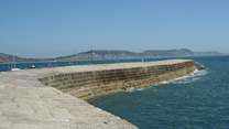 The iconic Cobb at nearby Lyme Regis, where you will also find a beach, summer water sports hire, fishing trips, and great places to eat and drink.